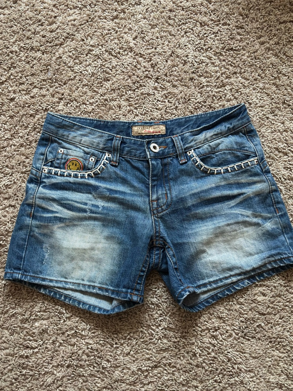 Distressed Blue Denim Shorts with Whipstitch Detail